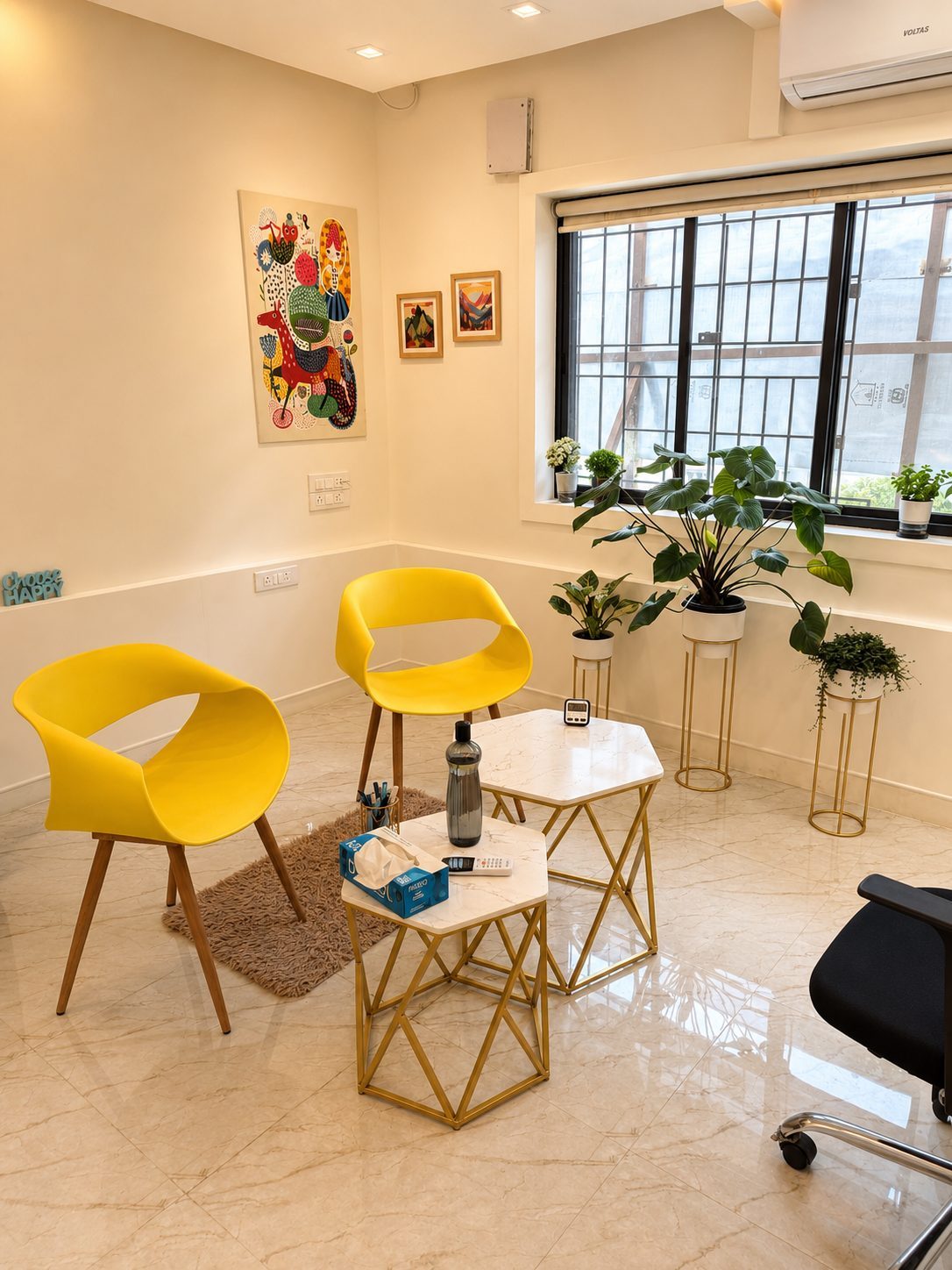 CINQ.IN counselling room with yellow chairs and plants
